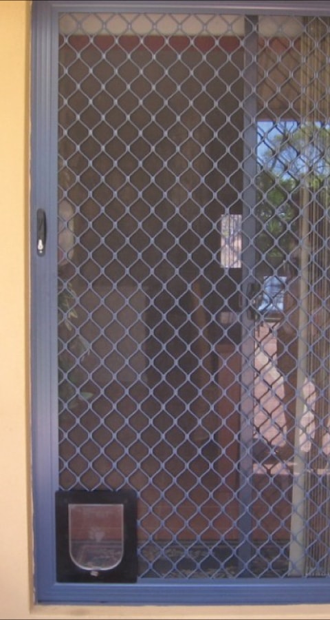 Diamond Grill Security Door with Pet Door by Doctor Glass